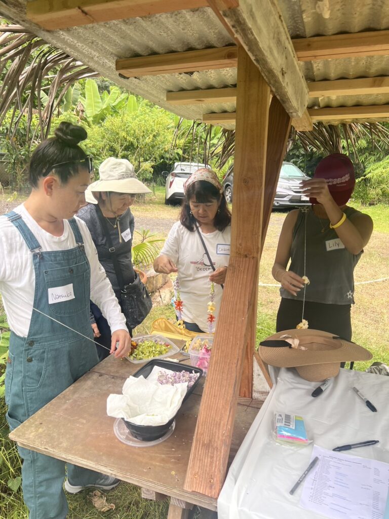 Making fresh flower leis for Suzue