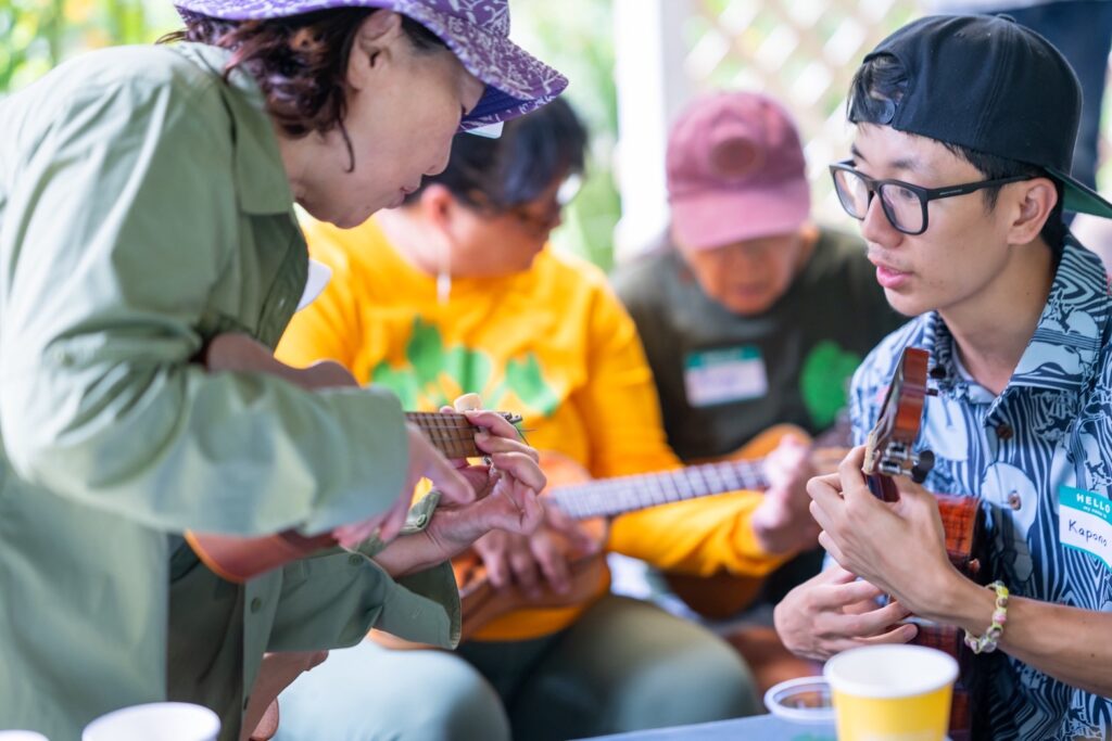 Kapono (right), a long-time student of Junior, assist his mentor to help beginners